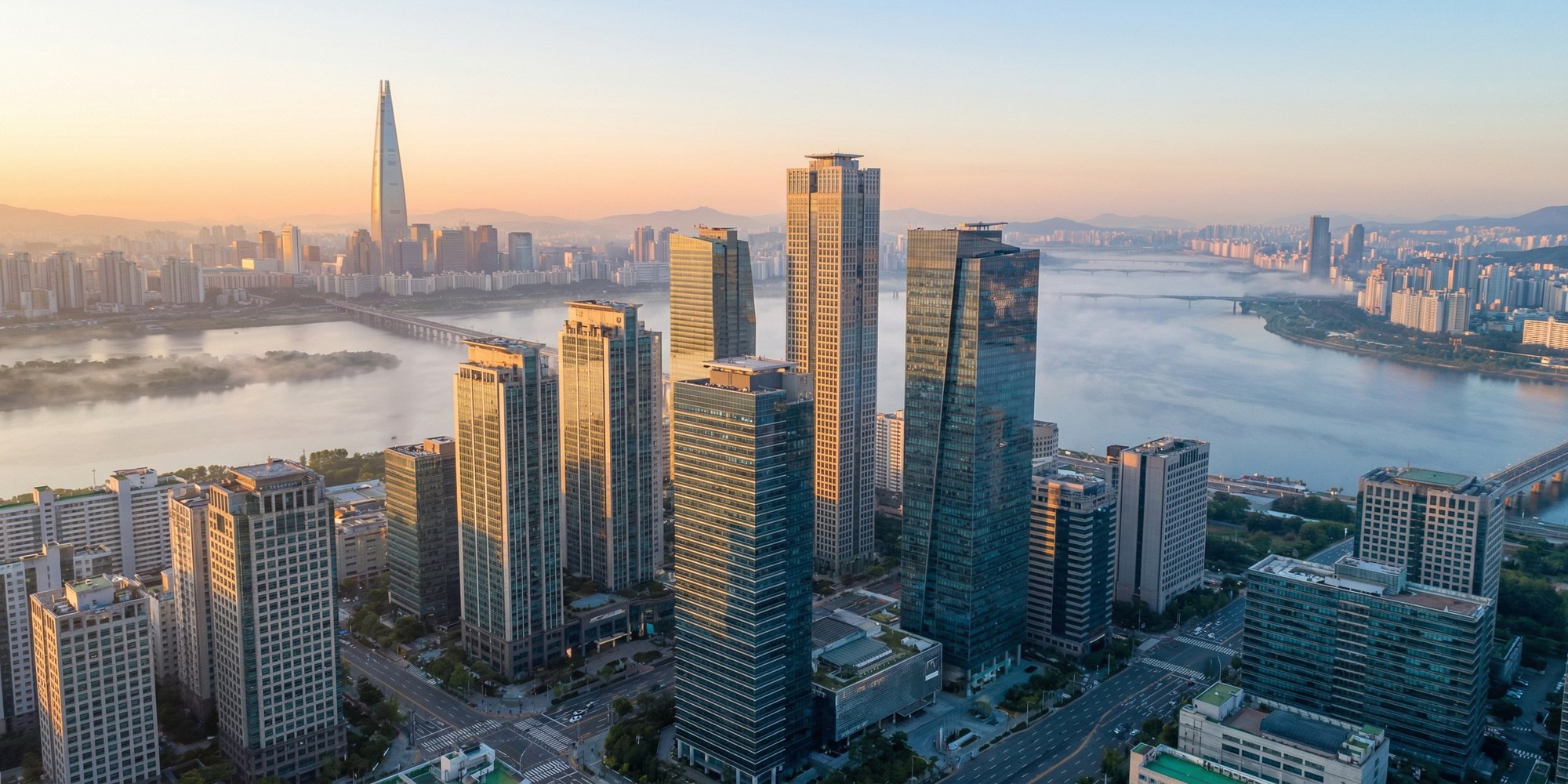 Seoul financial district skyline at dawn with Gangnam skyscrapers and Han River reflecting morning light